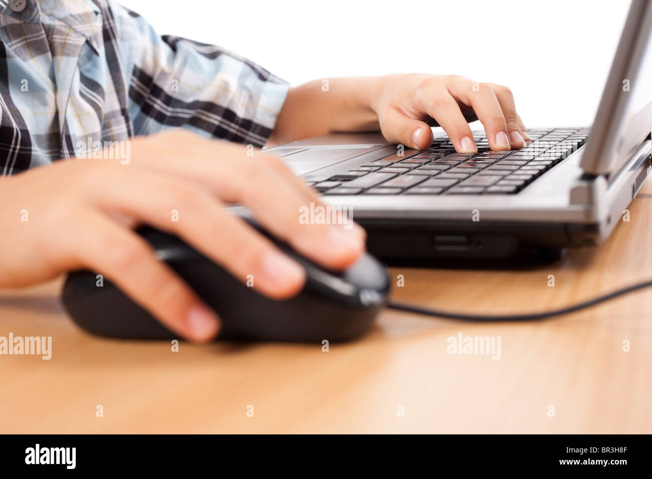 Close up of a schoolboy's hands using mouse and keyboard Stock Photo ...