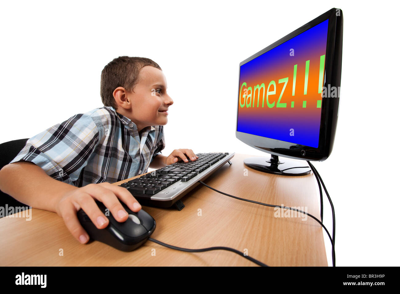Boy play game on gaming PC online Stock Photo - Alamy