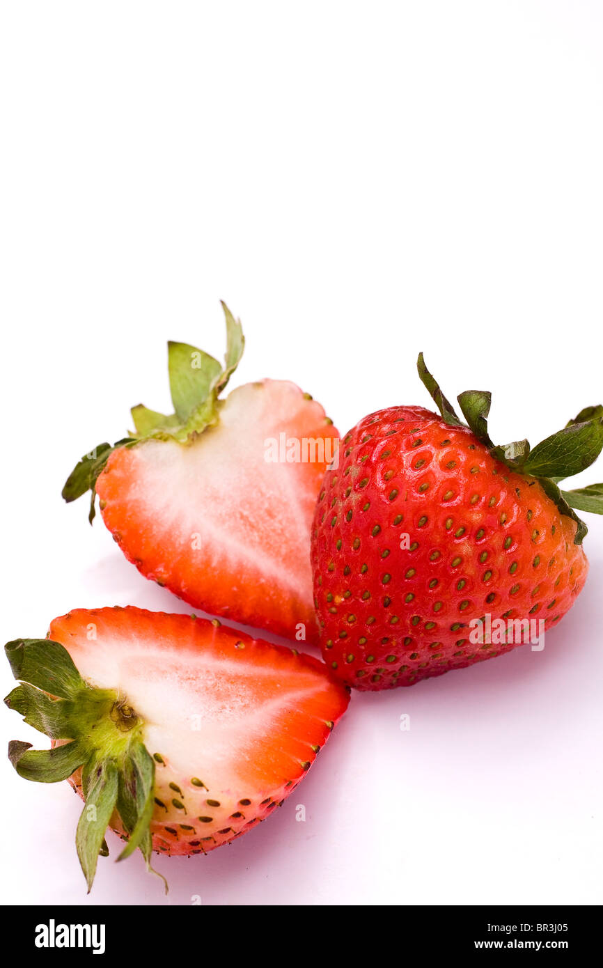 Beautiful strawberries isolated on white for texture Stock Photo - Alamy