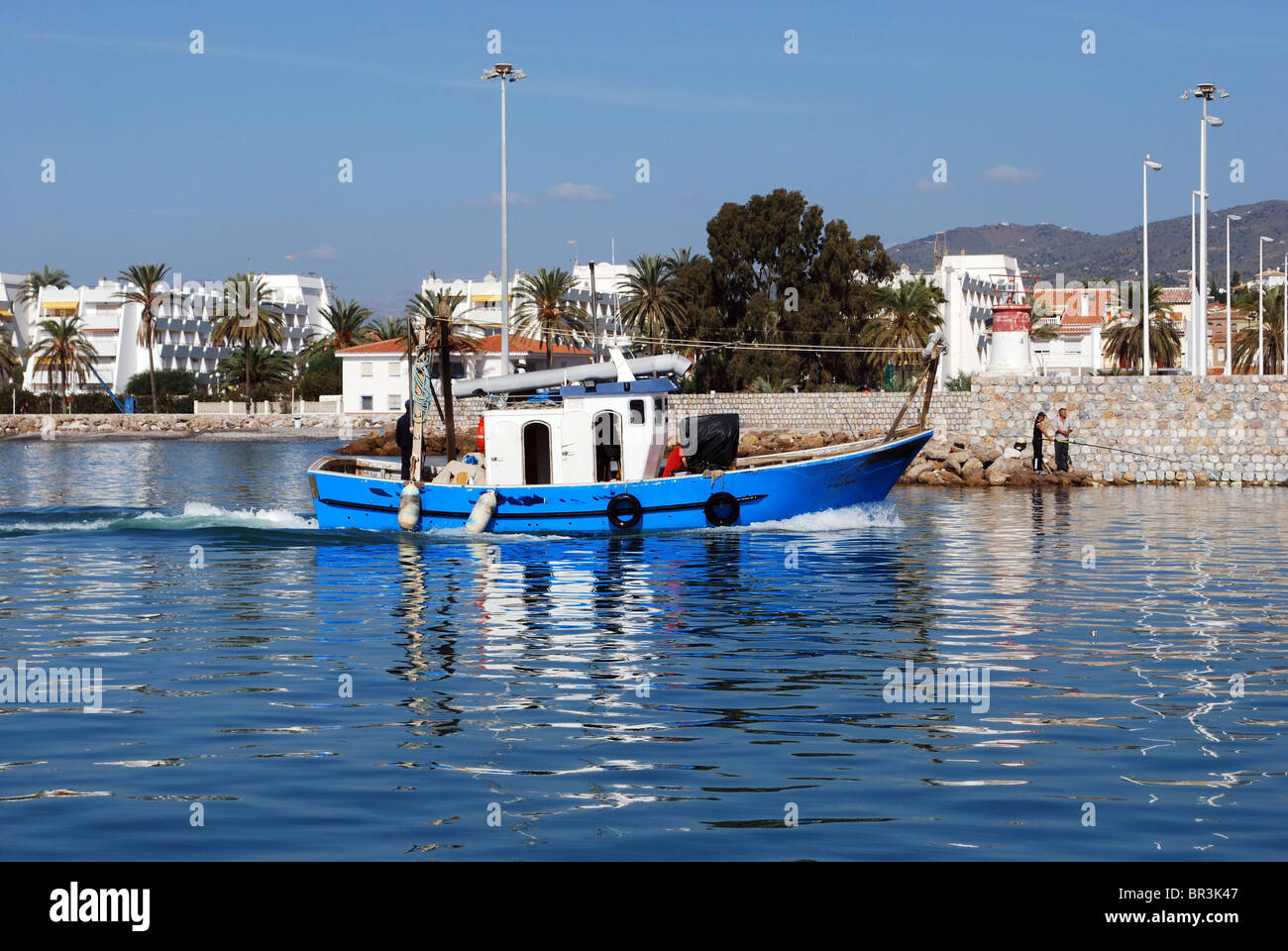 Fishing boat entering the harbour, Caleta de Velez, Costa Tropical, Costa  del Sol, Malaga Province, Andalucia, Spain, Europe Stock Photo - Alamy