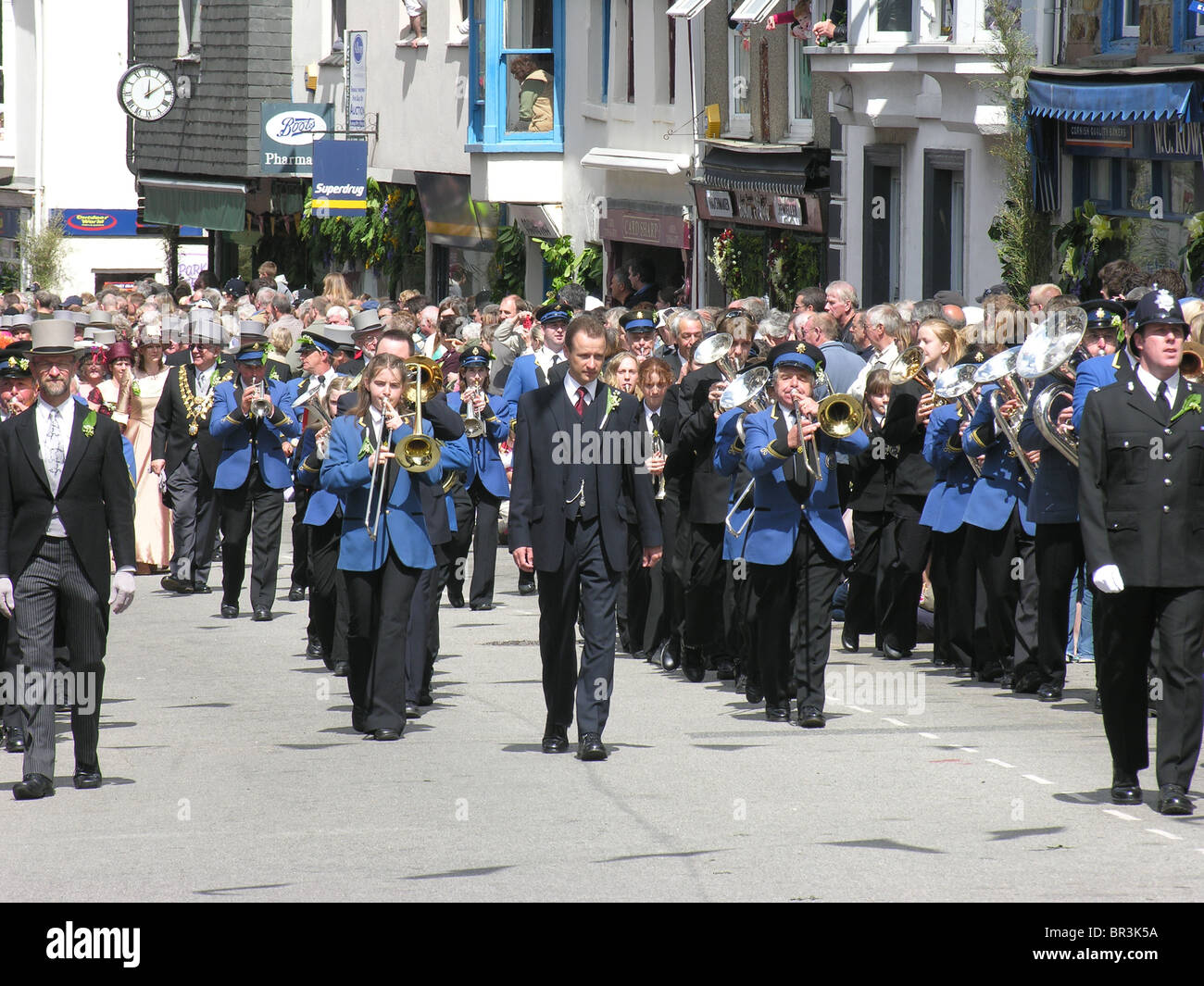 Dancers led by Helston Town Band taking part in the Midday Dance at Helston Flora Day, Cornwall Stock Photo