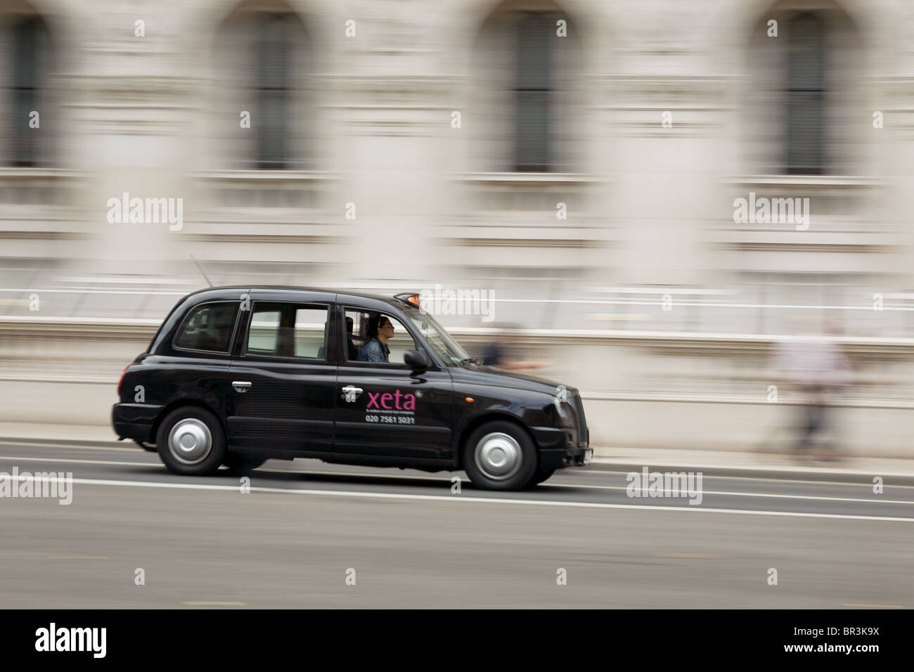 Taxi at speed in Central London Stock Photo