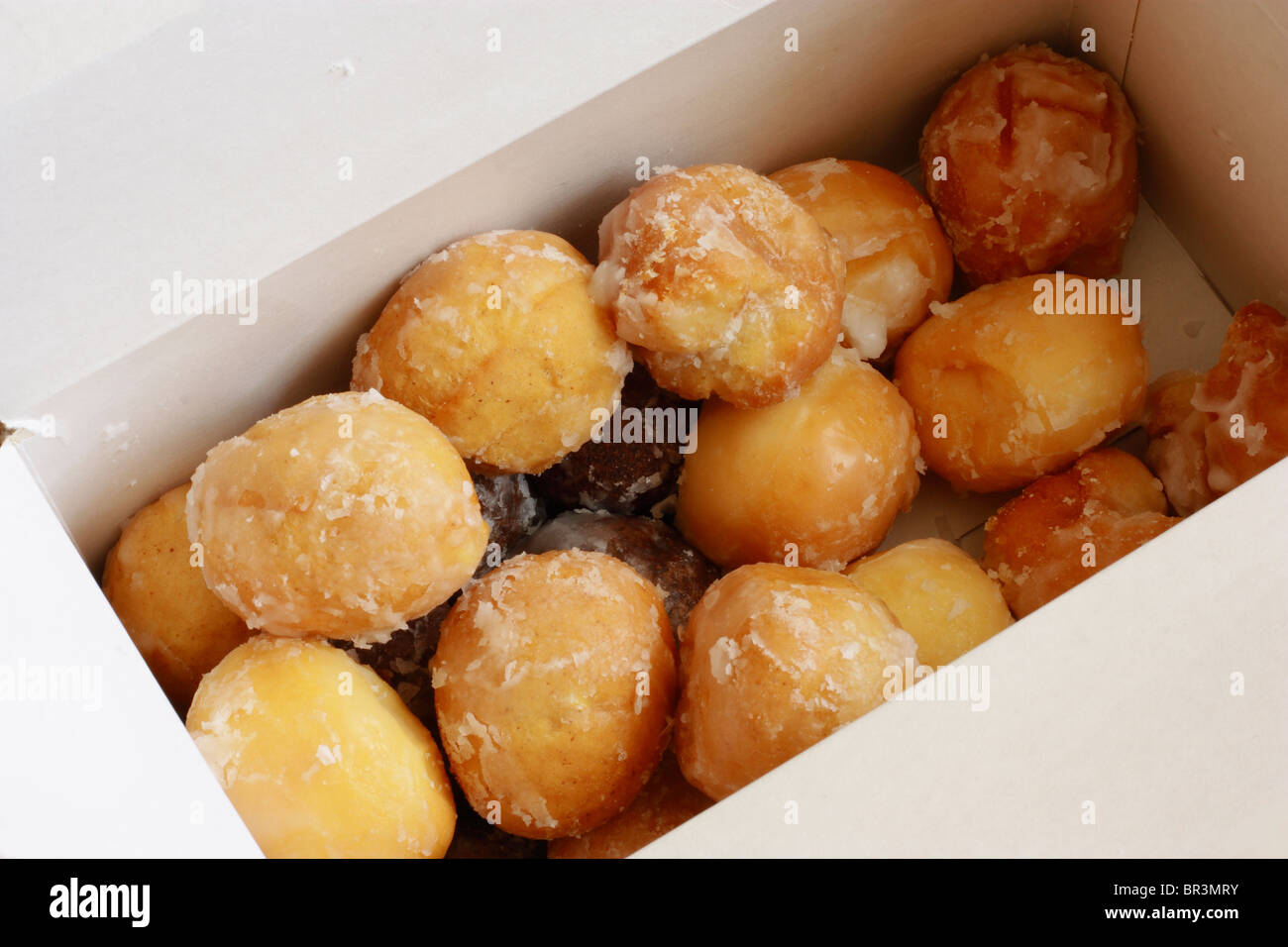 Box of various donut holes Stock Photo