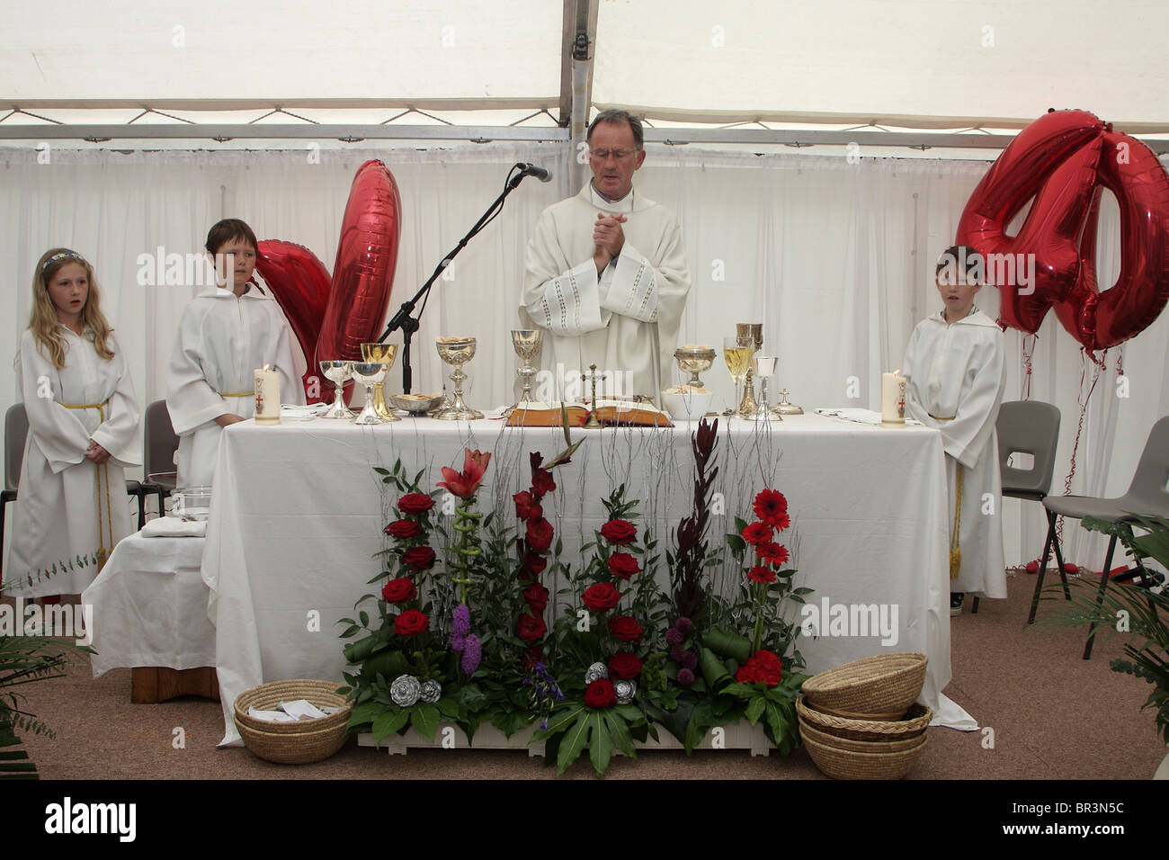 A catholic priest celebrates mass Stock Photo