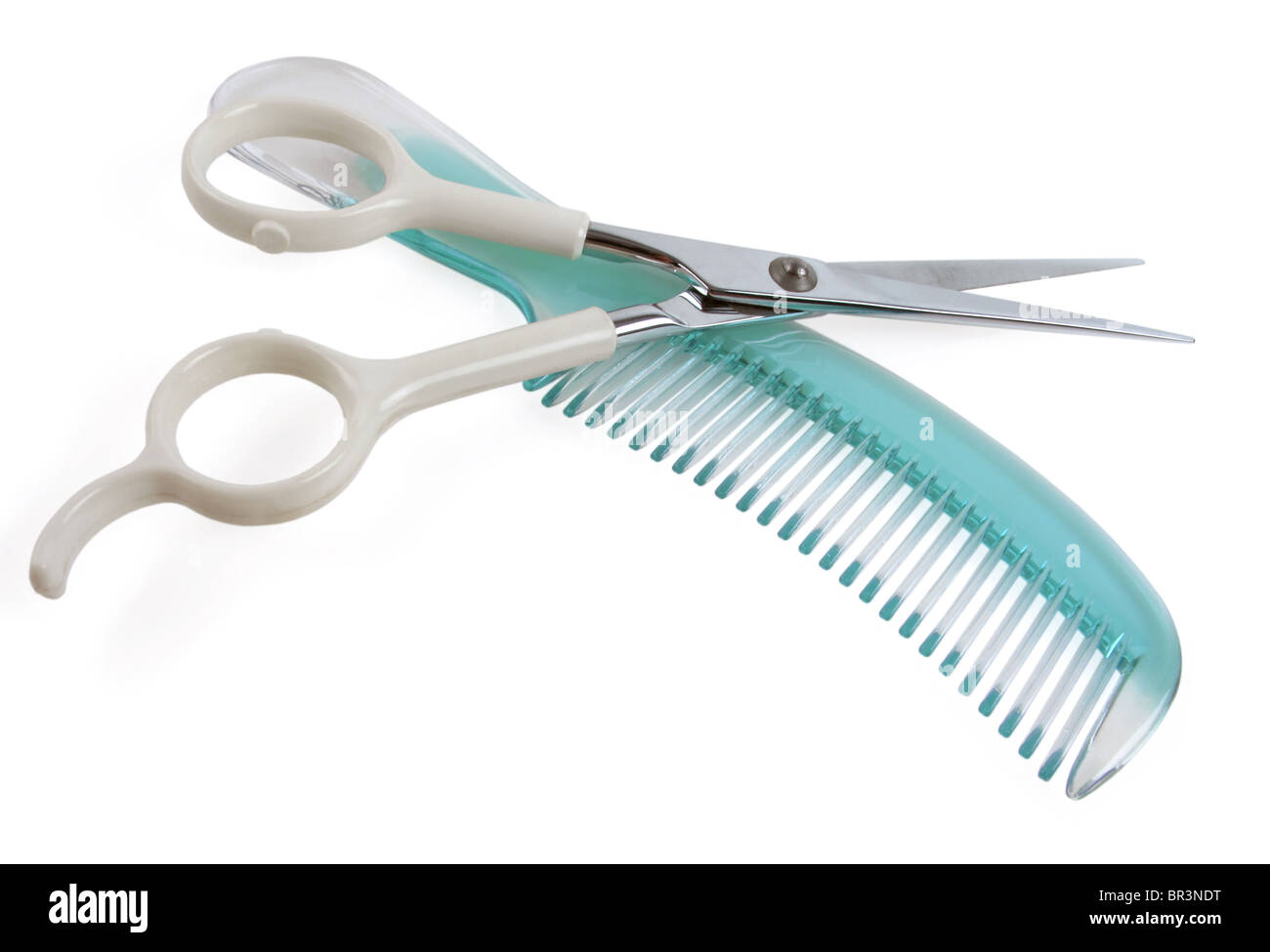 Clean and colorful comb and scissor ready for a haircut Stock Photo