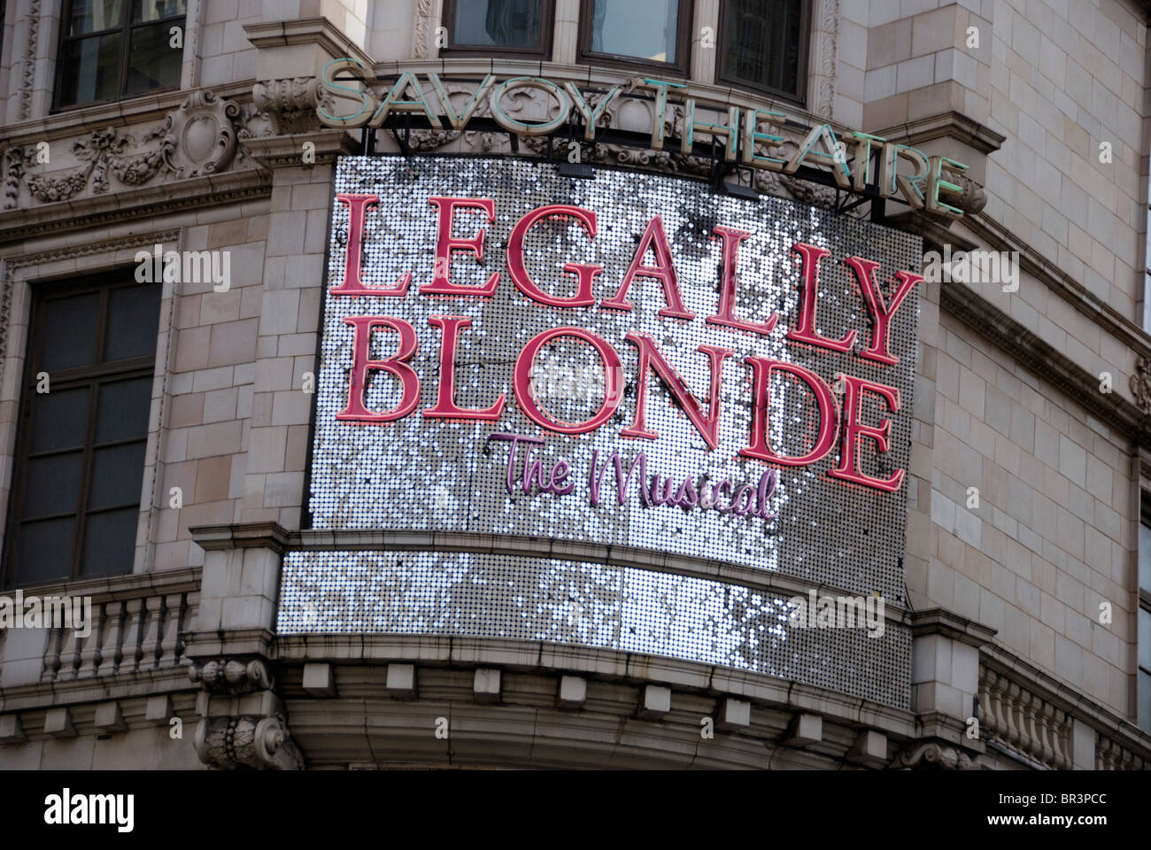 A large billboard promoting the musical 'Legally Blonde' outside the Savoy Theatre, London, England Stock Photo