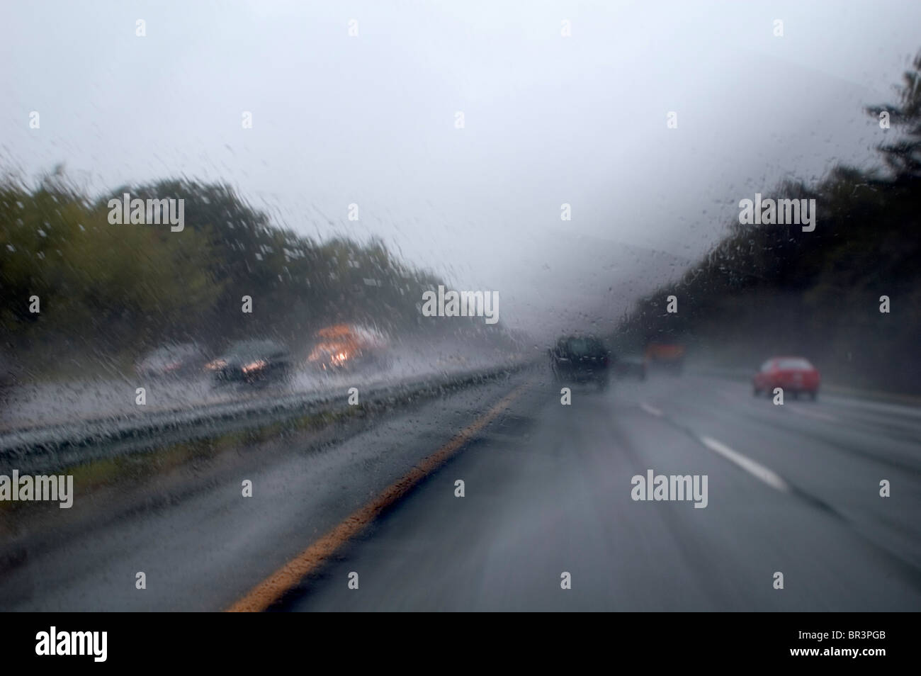Highway traffic in poor visibility Stock Photo