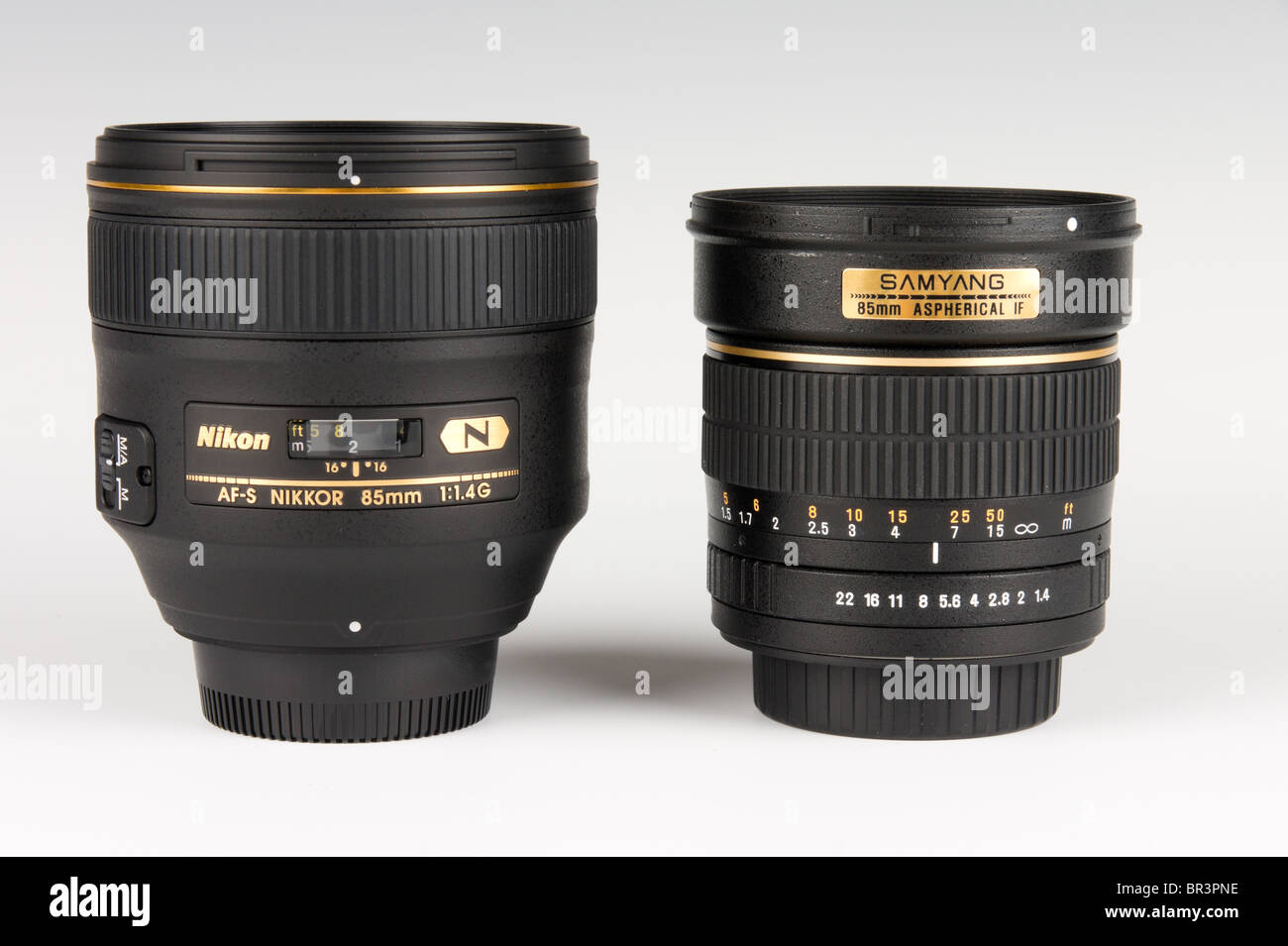 85mm SLR portrait lenses - Nikon 85mm costing £1500 and Korean Samyang 85mm  costing £200 - both f/1.4 fast portrait designs Stock Photo - Alamy