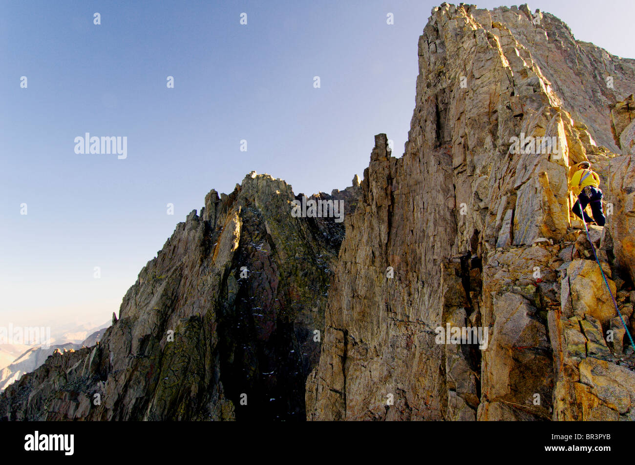 A climber ascends the twenty pitch arete of Split Mountain high in the Sierra Nevada, California Stock Photo