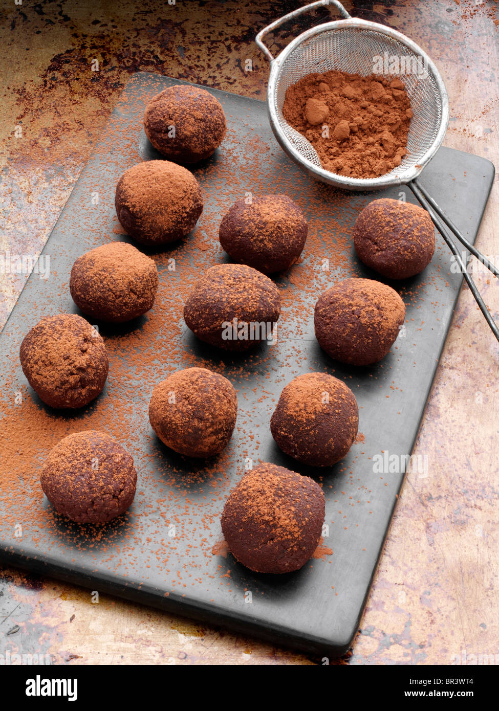 Chocolate truffles dusted with cocoa powder Stock Photo Alamy