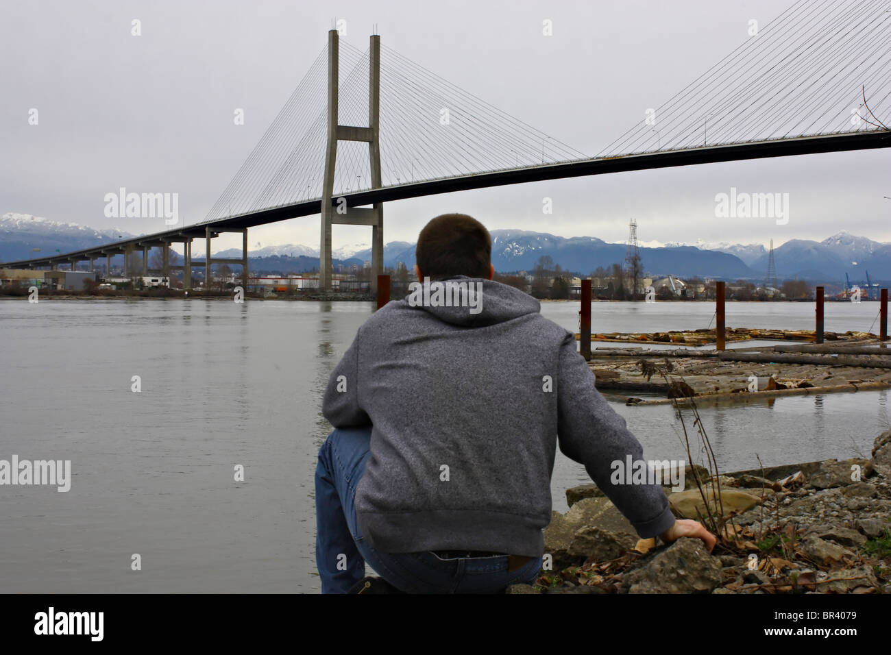 Man sitting on bridge looking hi-res stock photography and images - Alamy
