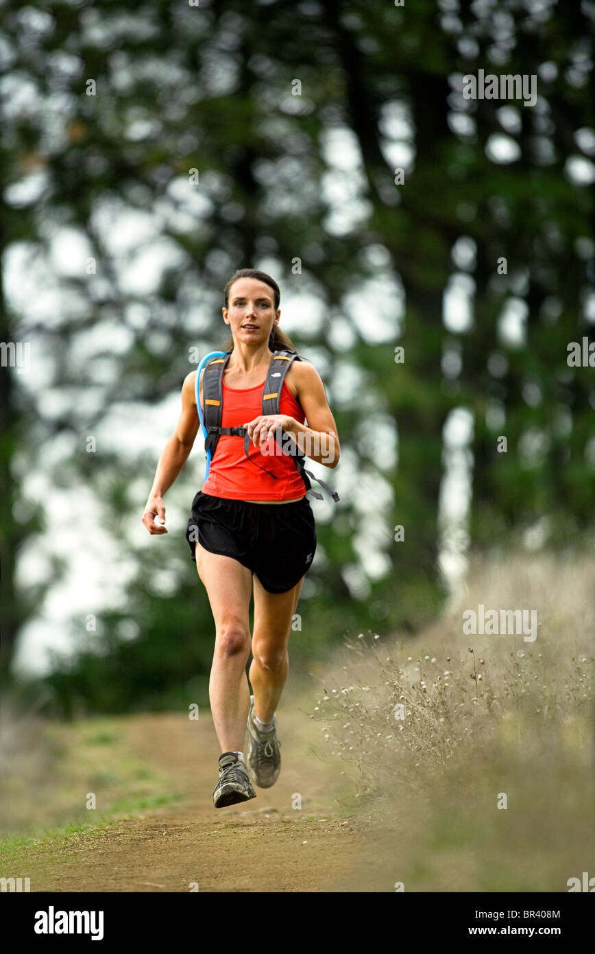 Woman trail running Stock Photo Alamy