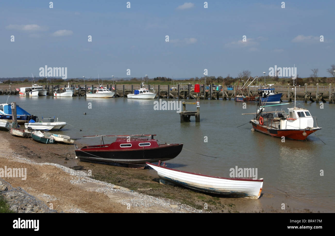 Fishing boats and pleasure craft moored in the tidal harbour at Rye, East Sussex Stock Photo