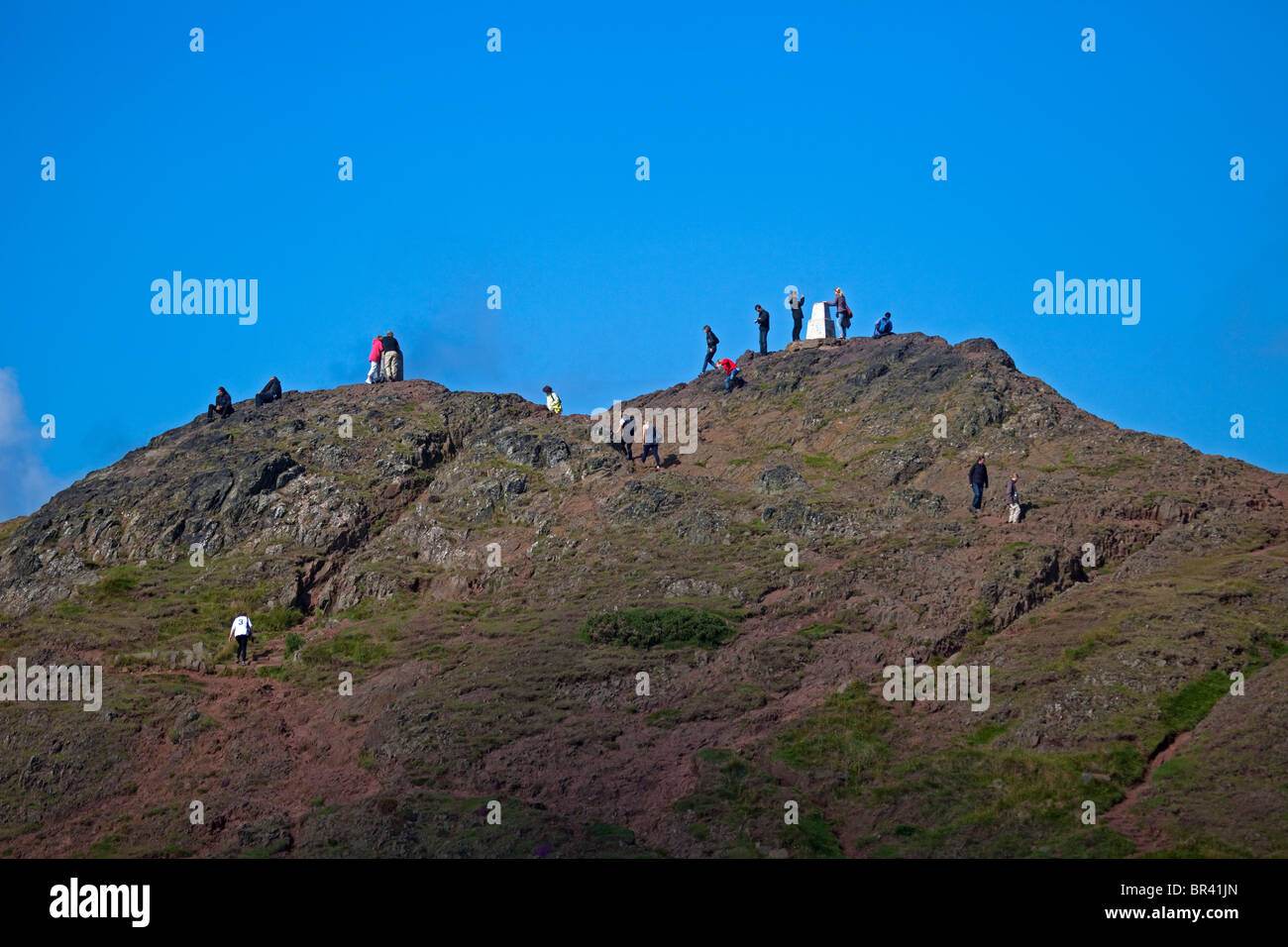 People on Summit of Arthur's Seat, Holyrood Park, Edinburgh, Scotland UK, Europe Stock Photo