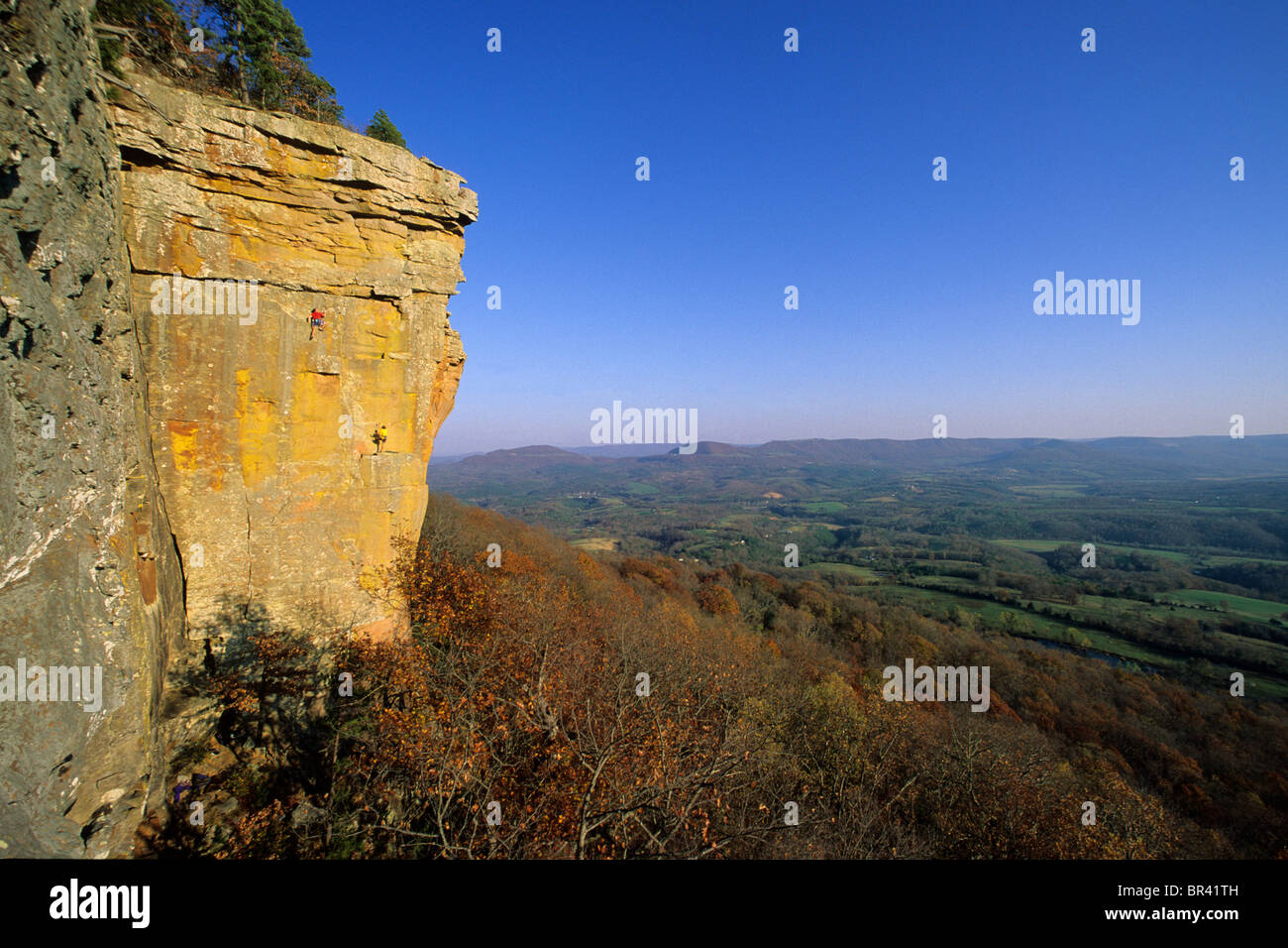 Two male rock climbers on sandstone bulff in Arkansas Stock Photo