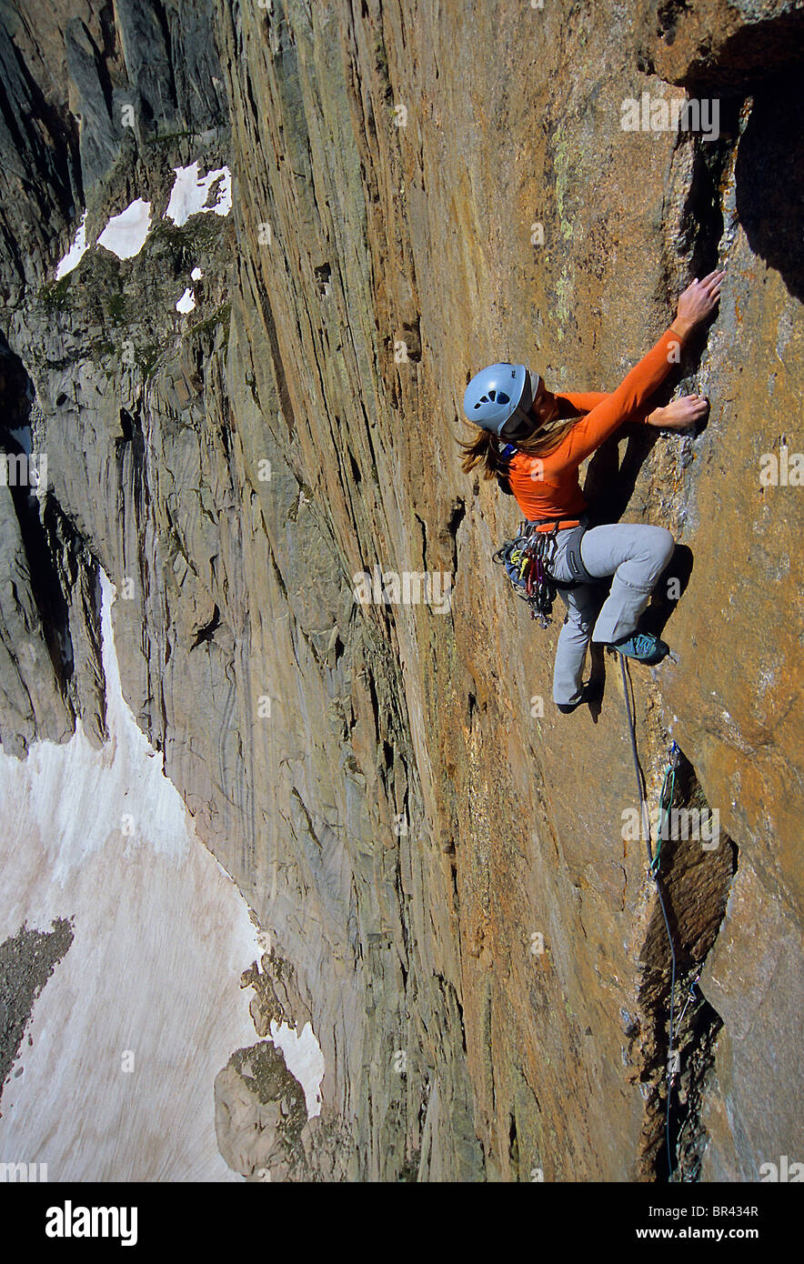 A woman rock climbing in Rocky Mountain National Park, Colorado. Stock Photo