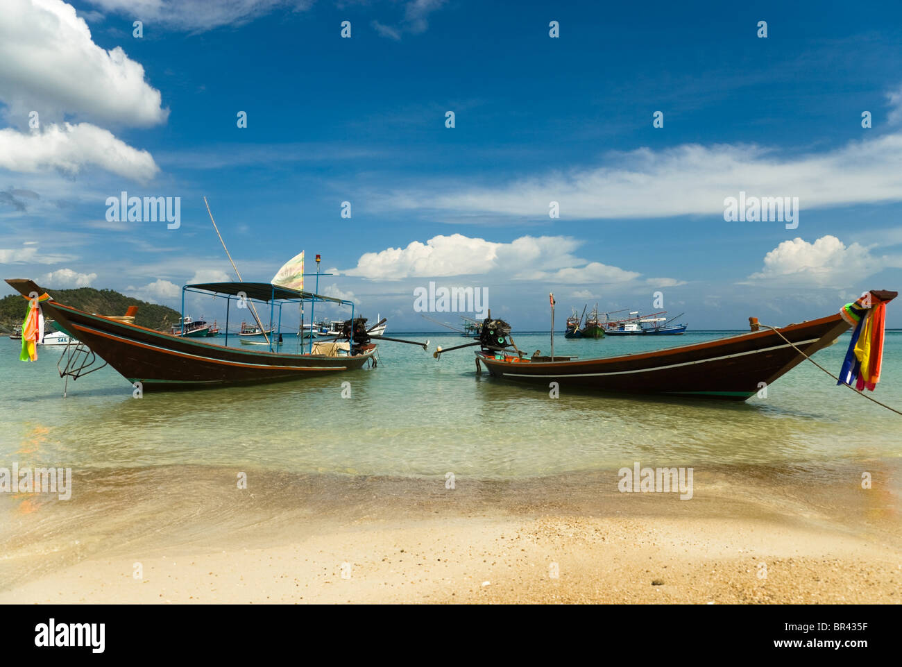 Longtail boats on the beach, Ko Phangan, Thailand Stock Photo