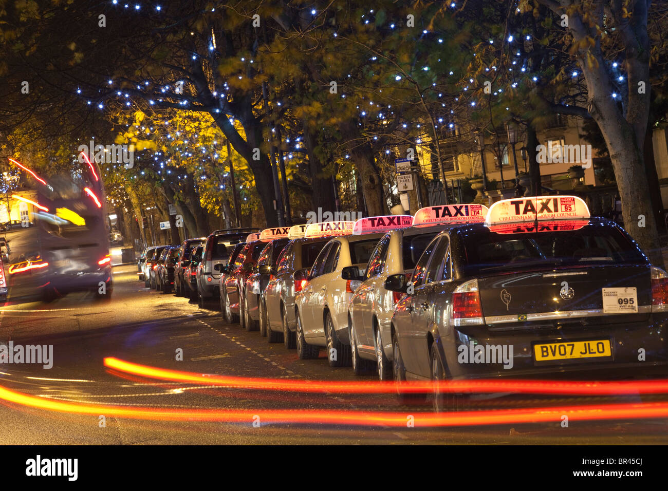 A taxi rank at night with christmas lights, Cheltenham, Gloucestershire