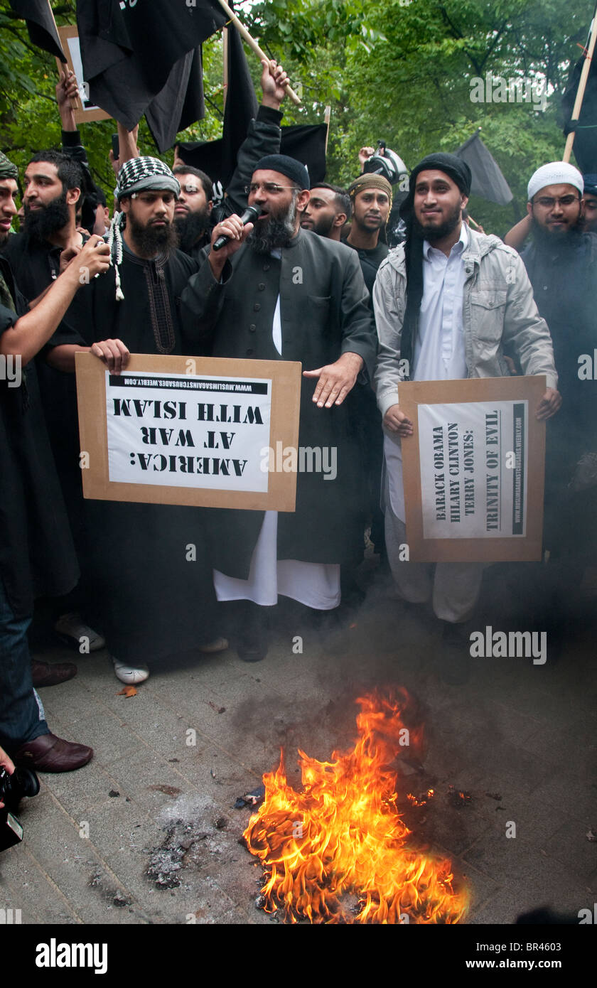 An extremist group 'Muslims Against the Crusades',led by Anjem Choudary (centre) burn the American flag protesting outside the U Stock Photo
