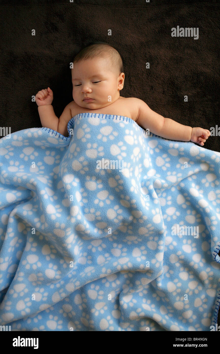 A baby sleeps under a blanket in Naples, Florida Stock Photo Alamy