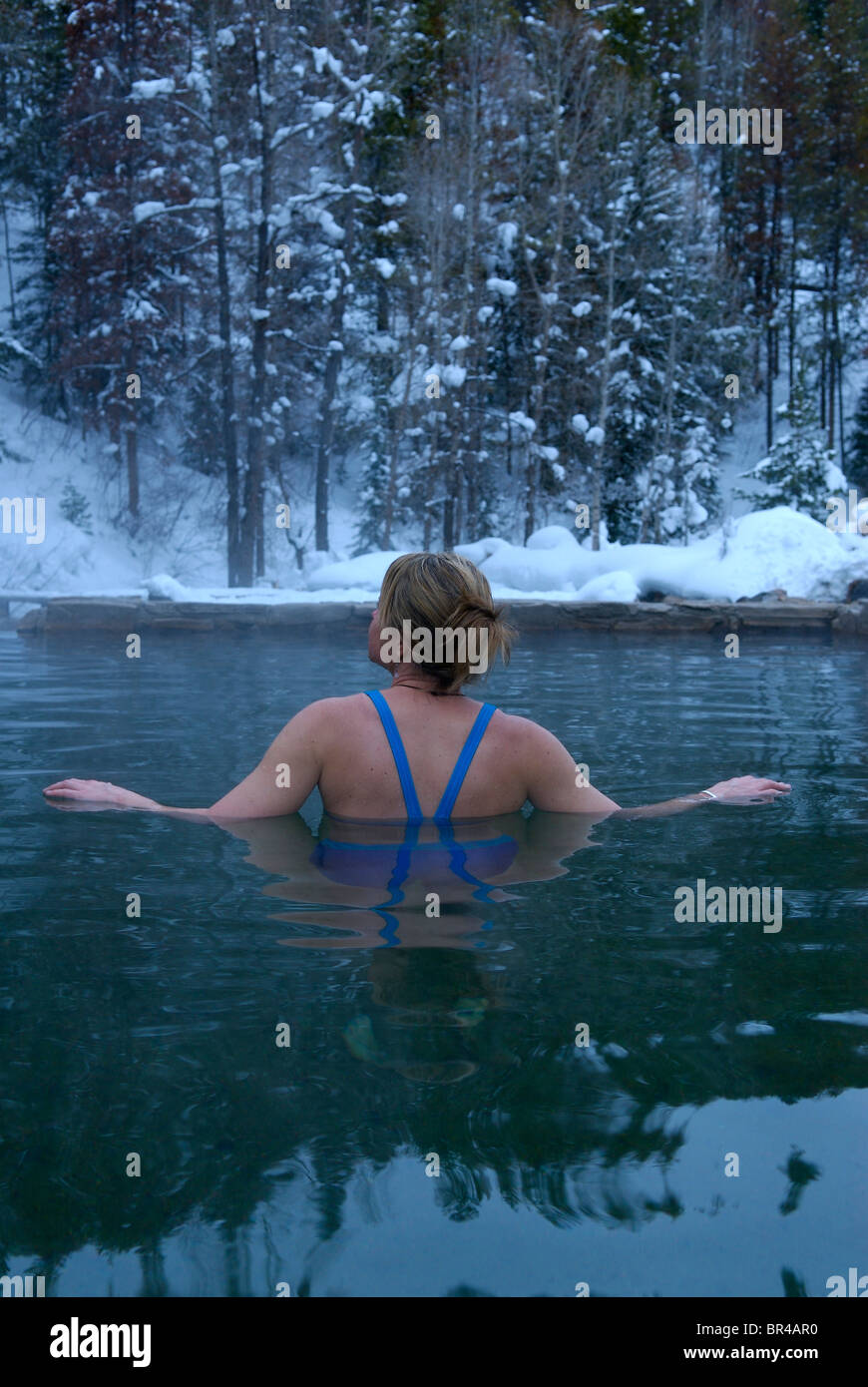 A woman at a natural hot springs near Steamboat Springs, Colorado Stock Photo