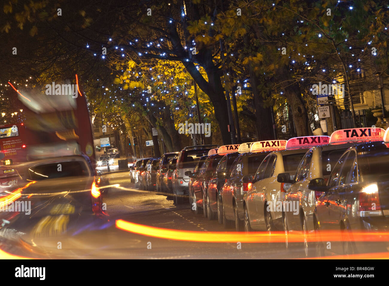 A taxi rank at night with christmas lights, Cheltenham, Gloucestershire