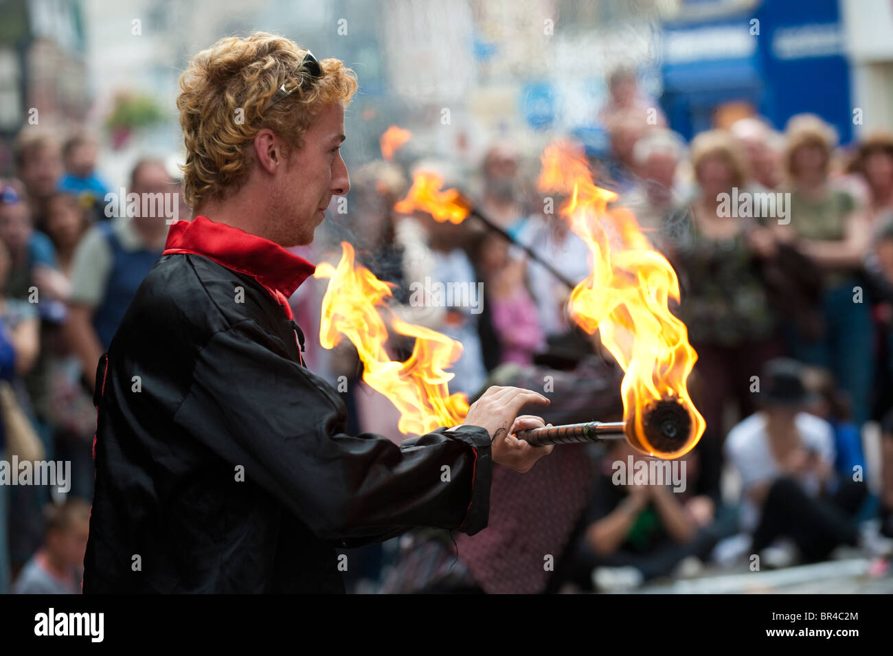 Juggling with fire at Shrewsbury  International Street Theatre Festival Shropshire, UK Stock Photo