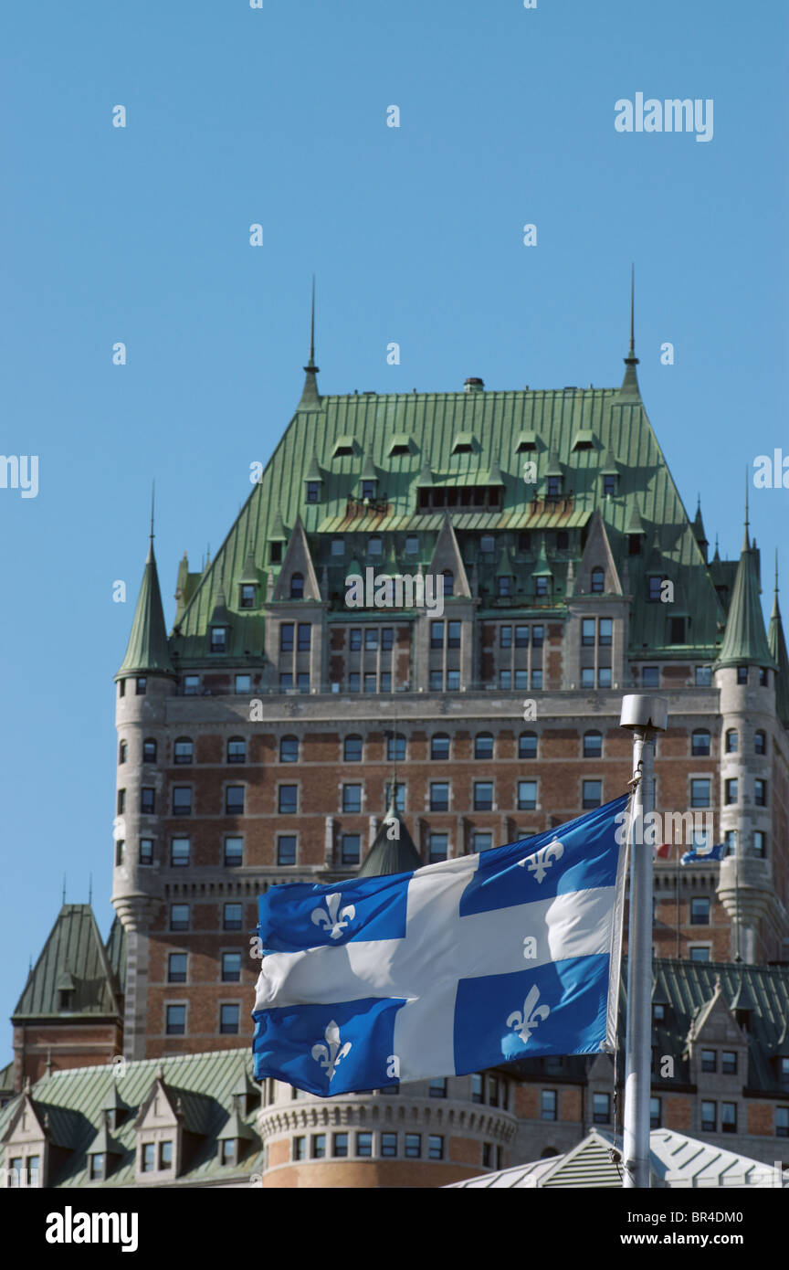 The Quebec flag flying in front of the Chateau Frontenac Stock Photo