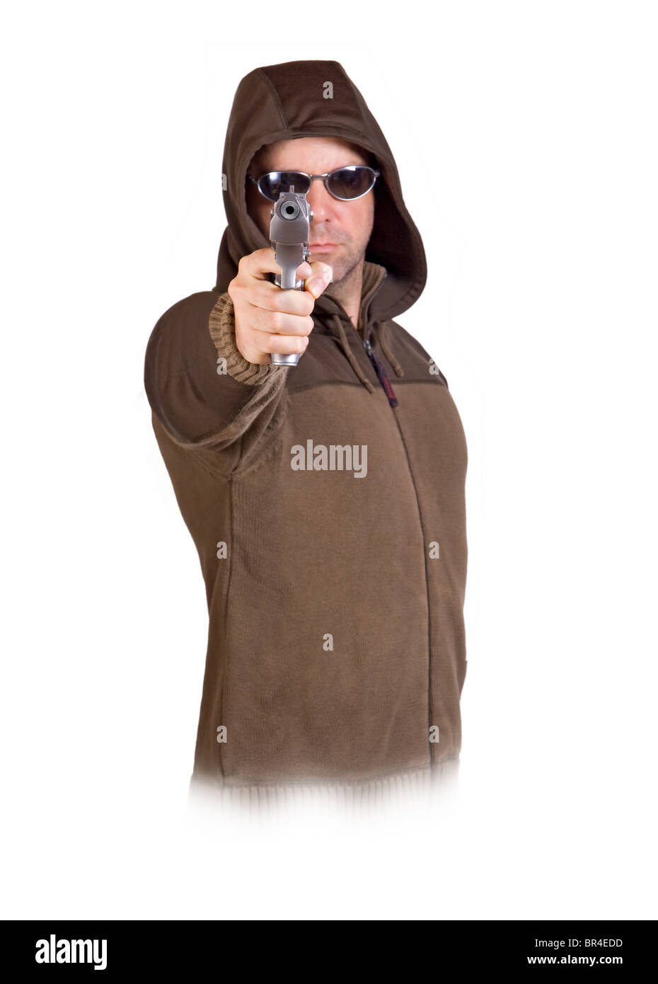 man in a hood with gun Stock Photo