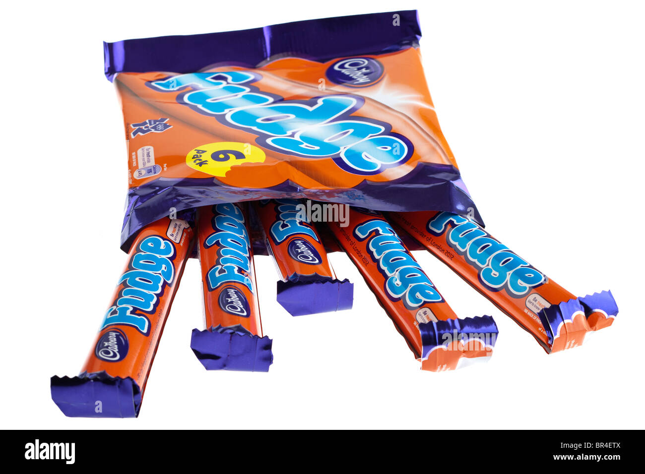 Six individually wrapped Cadbury's fudge chocolate bars spilling from a packet Stock Photo
