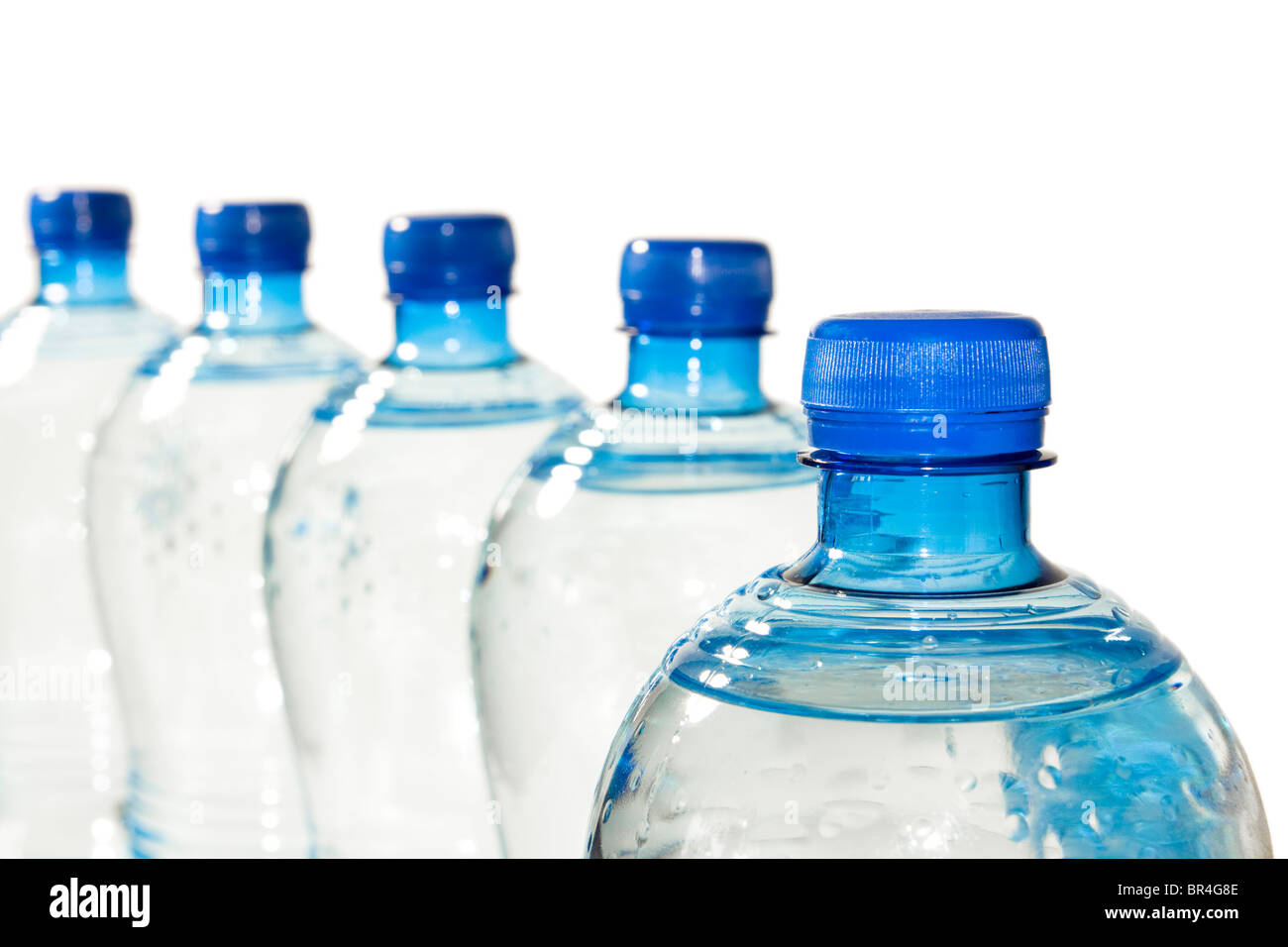 A row of bottles of water isolated on white Stock Photo