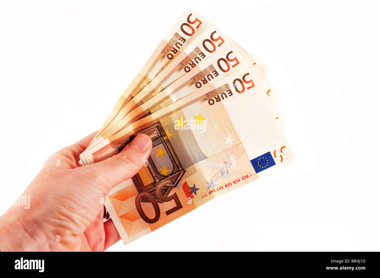 fifty euro banknotes held in a female hand Stock Photo