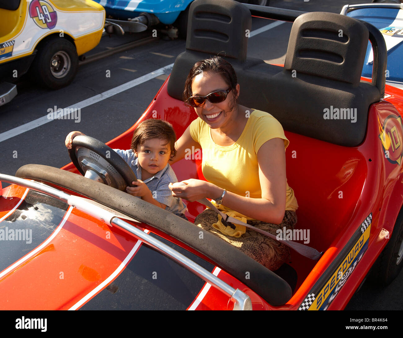 Mother and son in bumper car Stock Photo