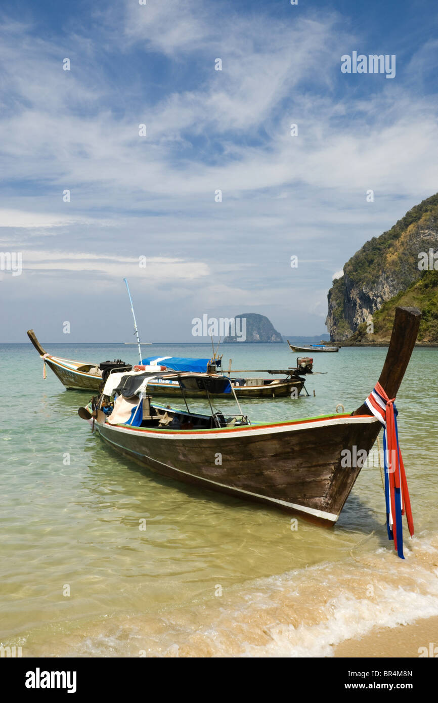 Longtail boats on the beach of Ko Muk, Thailand Stock Photo