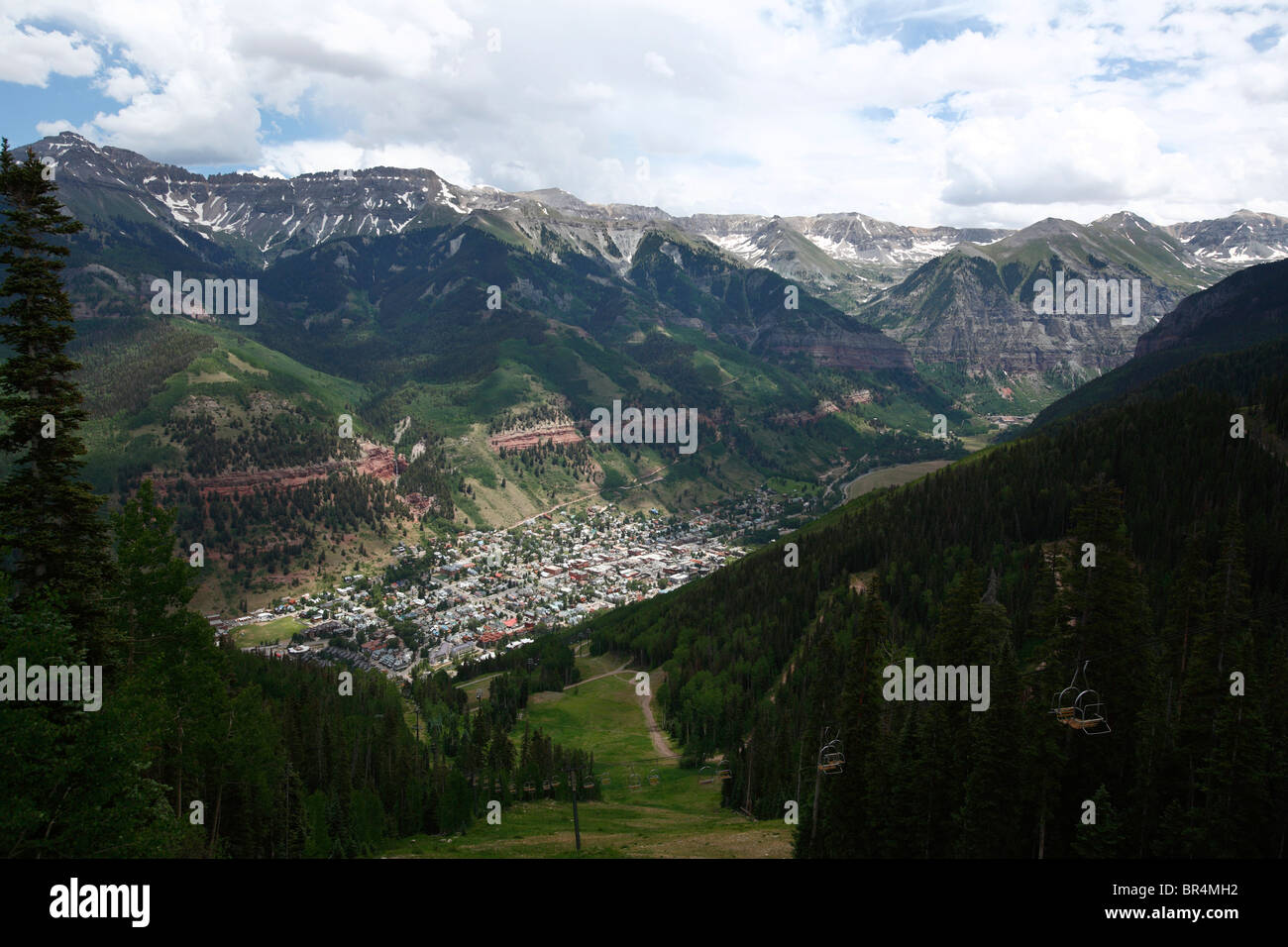 Scenic view of downtown Telluride nestled in the mountains as seen from atop the tram station atop the ski mountain. Stock Photo