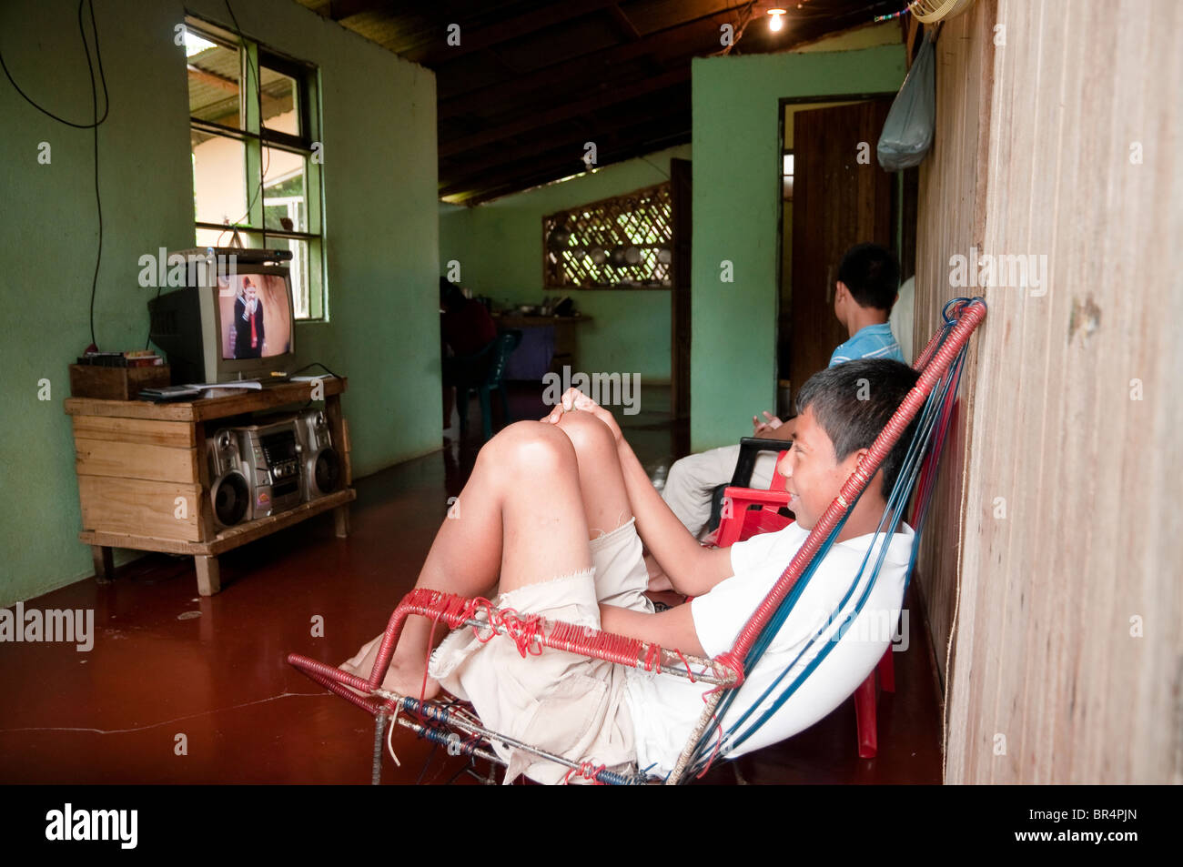 Maleku's children, looking television, Costa Rica Stock Photo