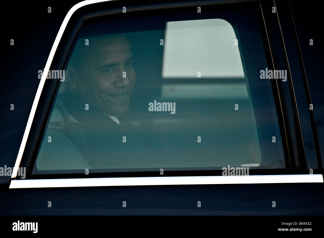 Obama rides in his limo during the Inaugural Parade in Washington Stock Photo