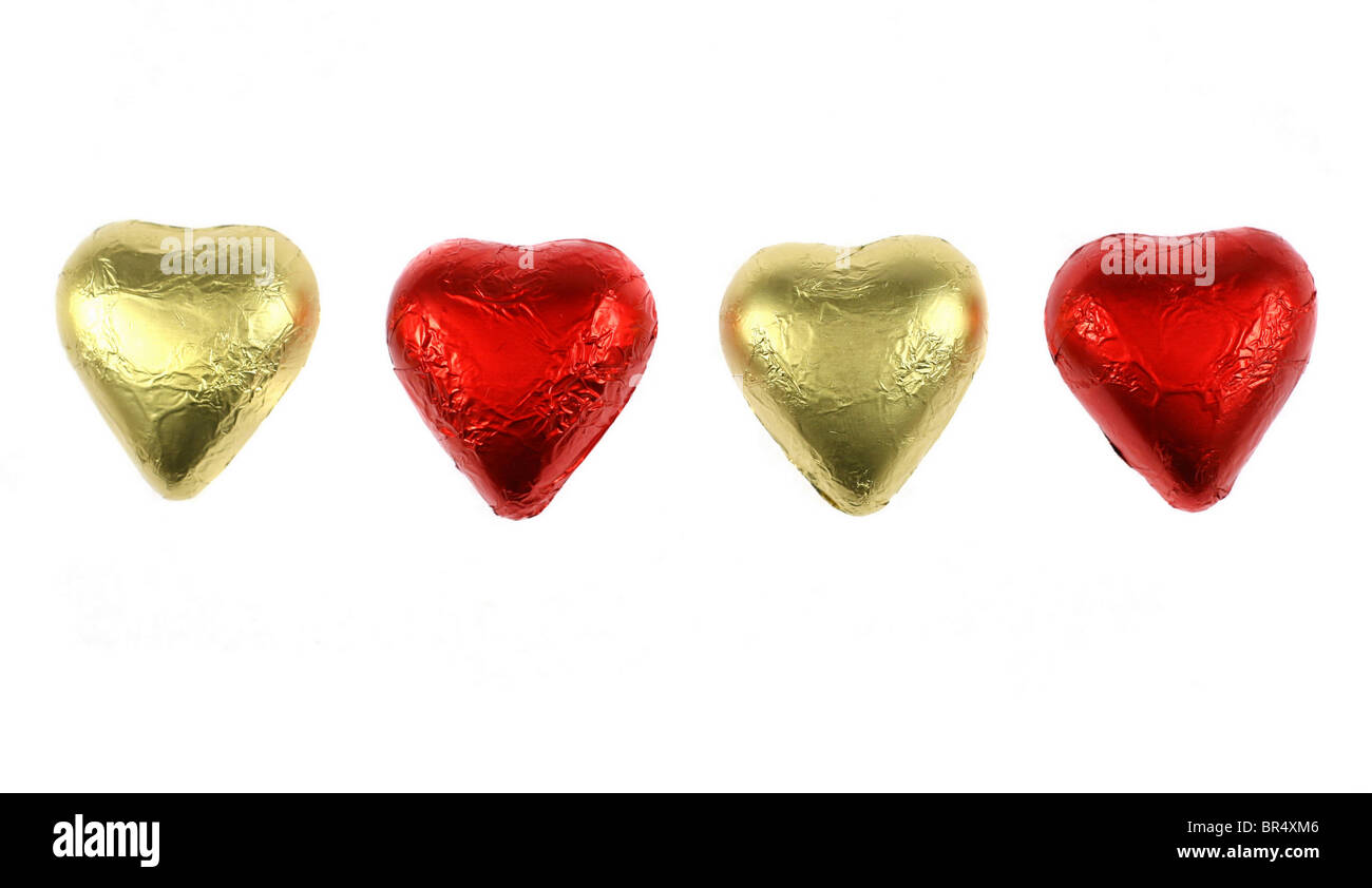 Four chocolate hearts isolated on white (for the St.Valentine's Day) Stock Photo