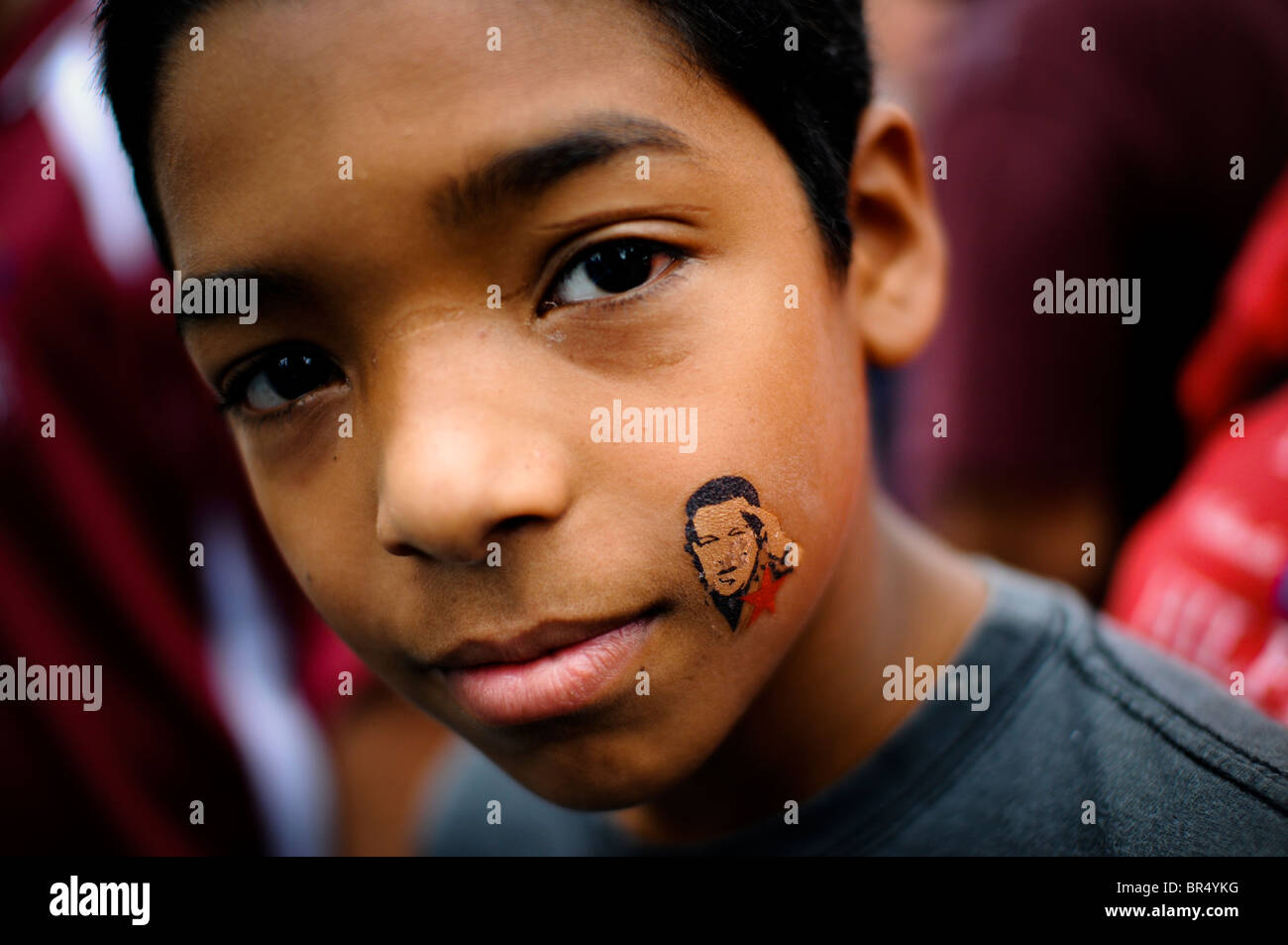 Young Venezuelan boy with President Chavez temporary tattoo in Caracas. Stock Photo