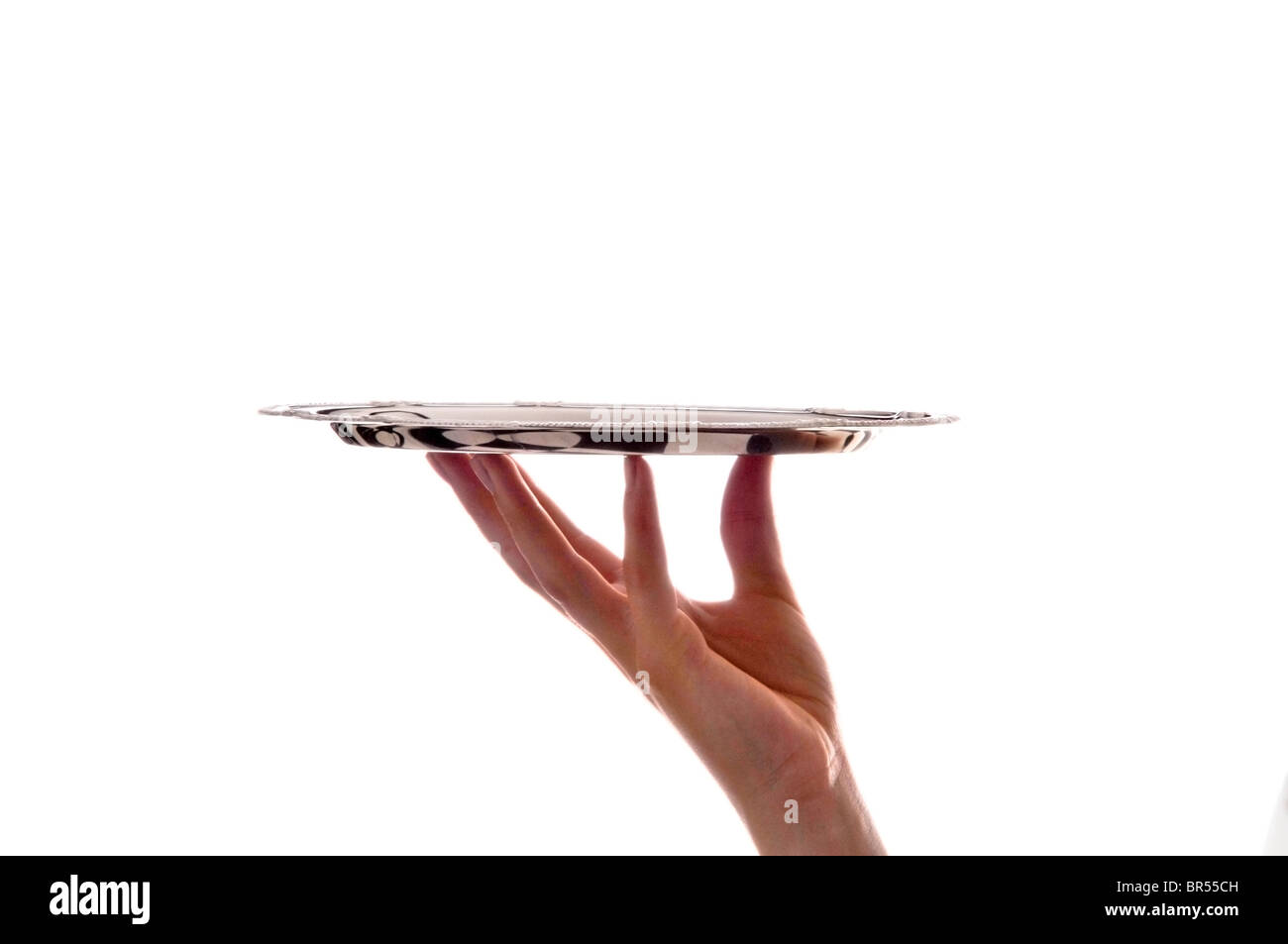 hand holding silver tray on white Stock Photo