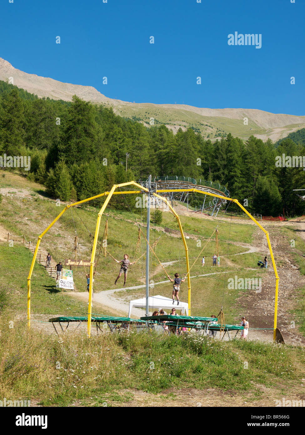 Trampoline installation with safety elastic bands. Les Orres, Hautes Alpes, France alt. 1600m Stock Photo