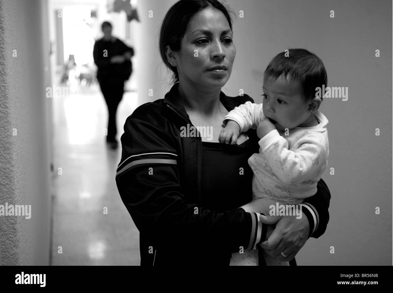 A prison mother leaves the prison daycare center with her baby inside a female penitentiary in Mexico D.F. Stock Photo