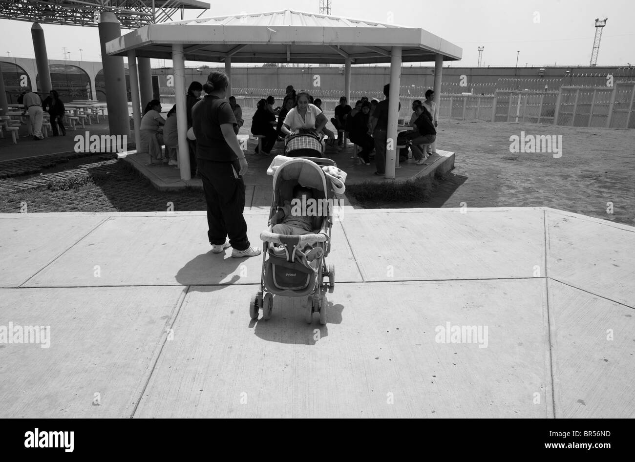 A baby in a stroller in a prison yard in Mexico D.F. Stock Photo