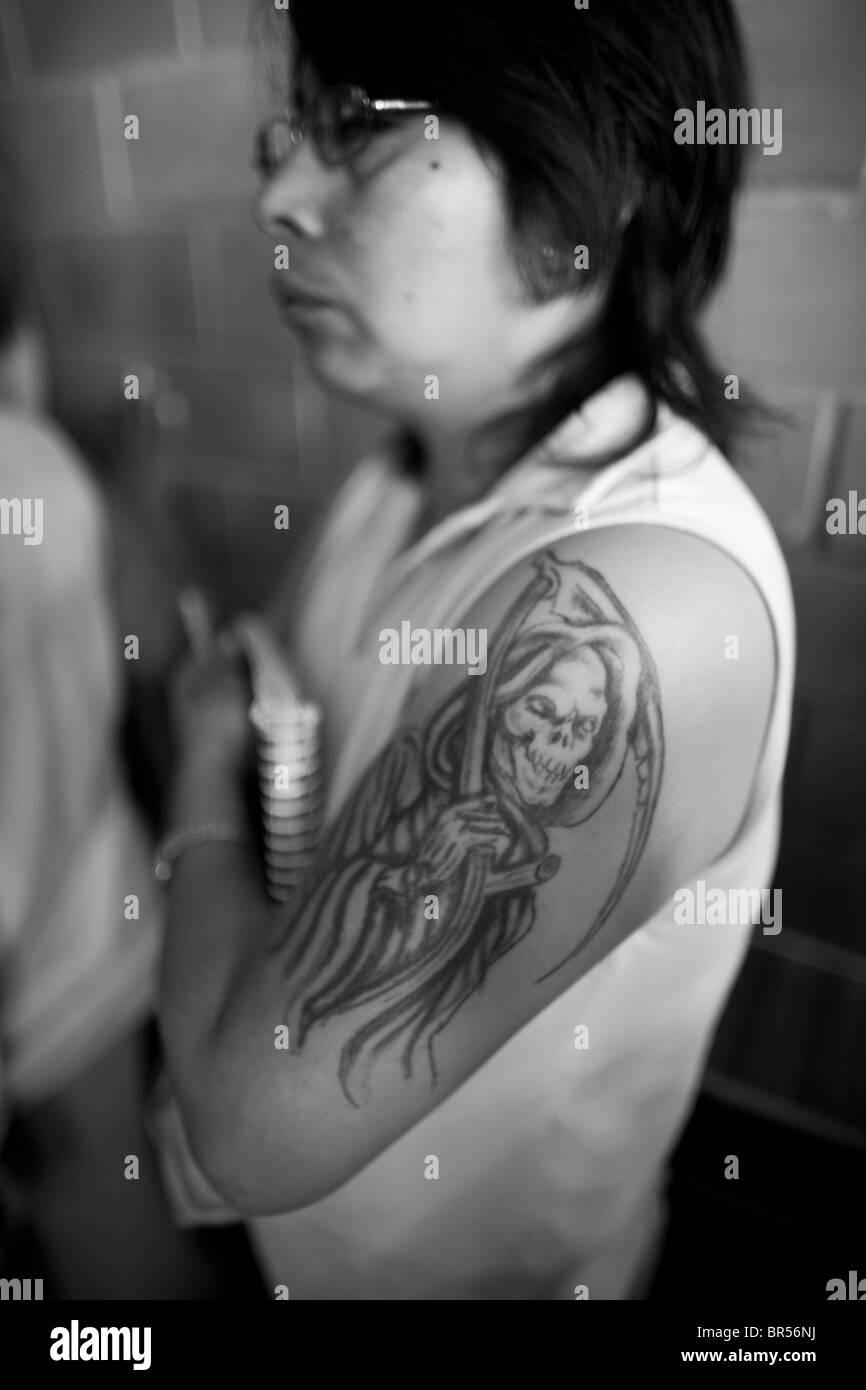 A female prisoner with a Santa Muerte tattoo waits for a class inside a female penitentiary in Mexico D.F. Stock Photo