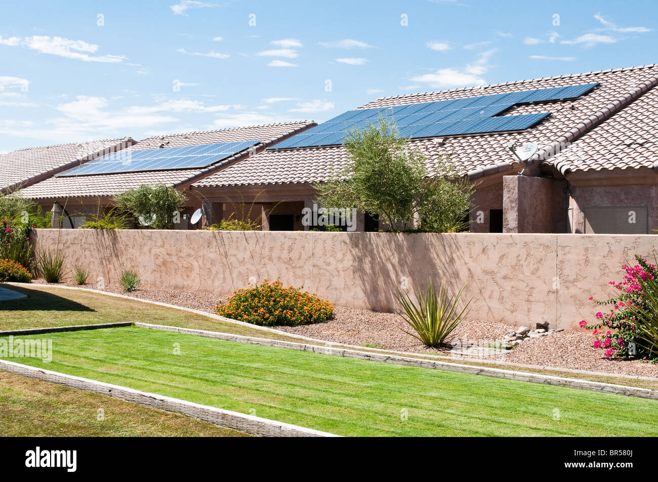 Roof mounted solar panels supply electrical energy to suburban homes in