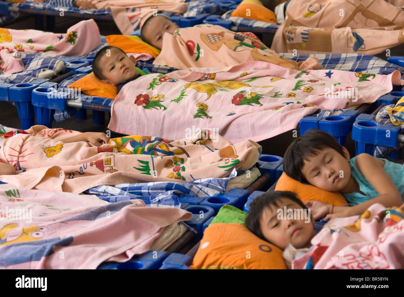 Children take a nap in the kindergarten, Dunhuang, Gansu Province, China Stock Photo