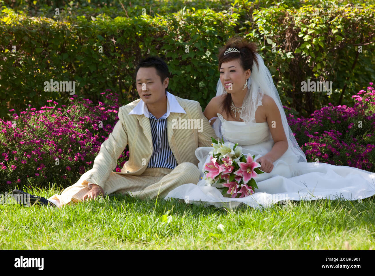 wedding couple in park in Turpan Xinjiang China. Stock Photo