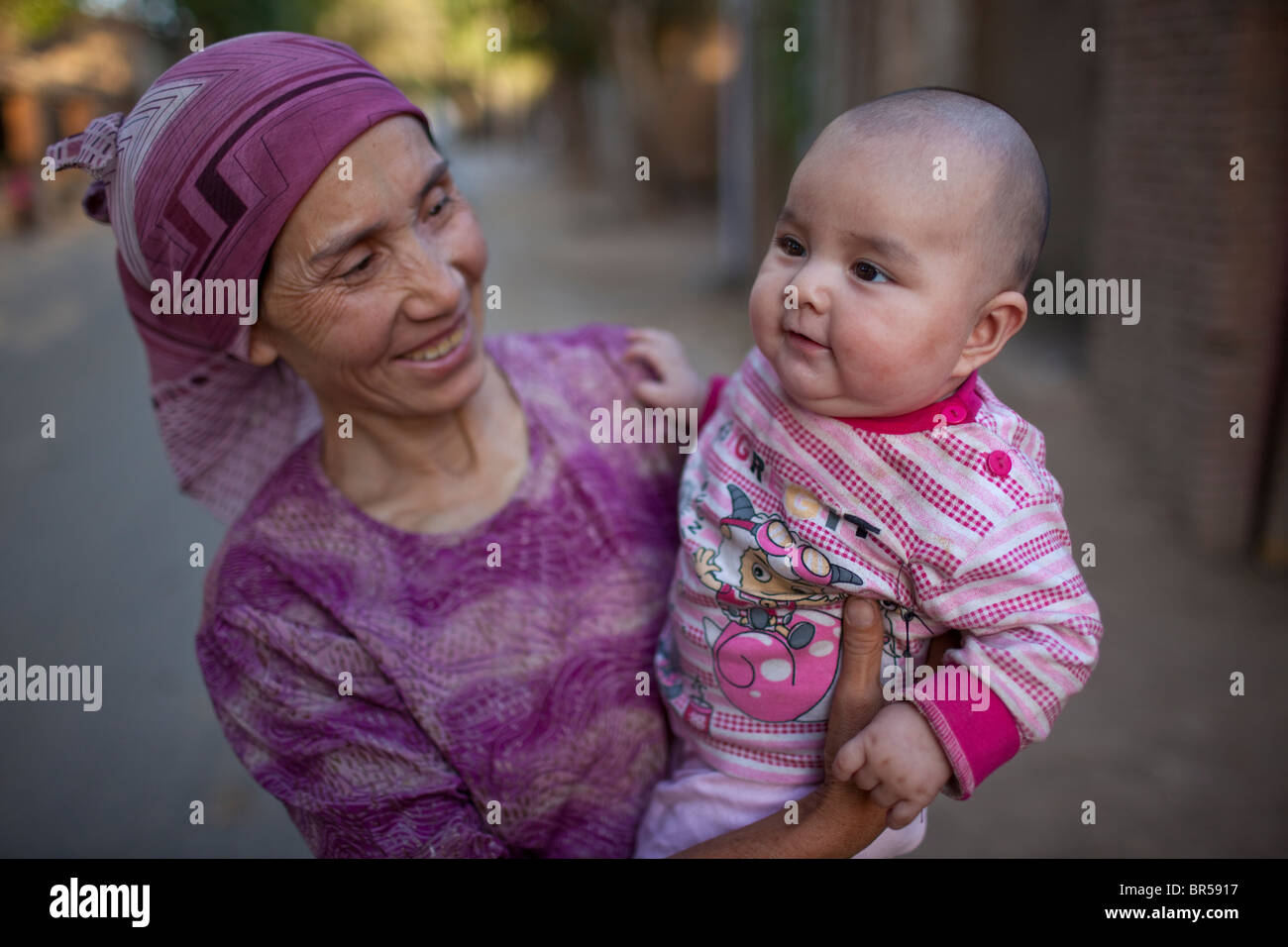 Grandmother and baby in Turpan Xinjiang China. Stock Photo