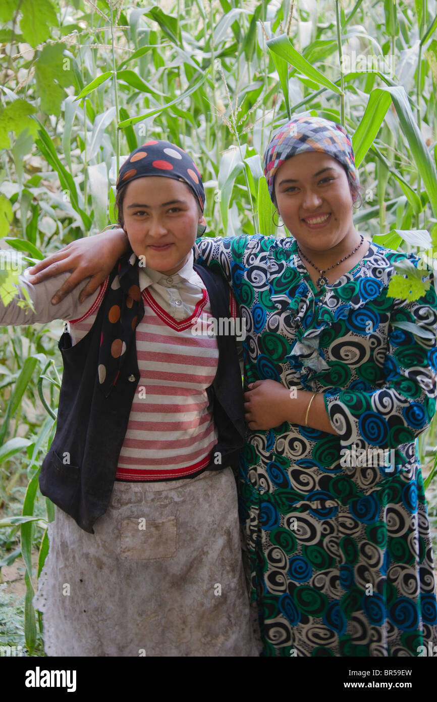 Uighur girls in the corn field, Hotan, Xinjiang, China Stock Photo
