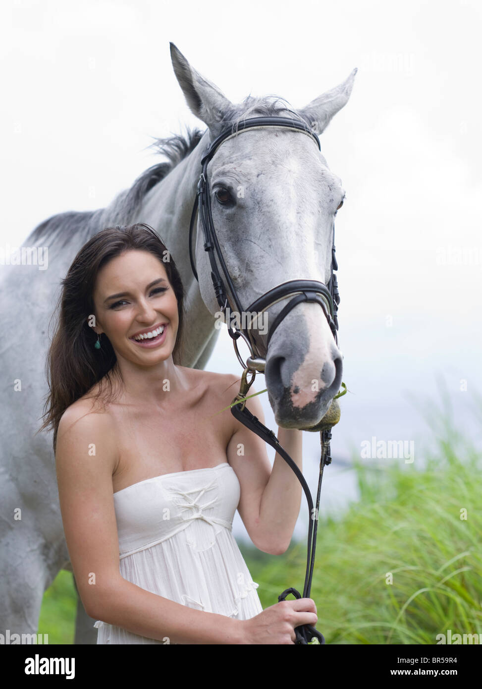 Beautiful young woman with horse Stock Photo
